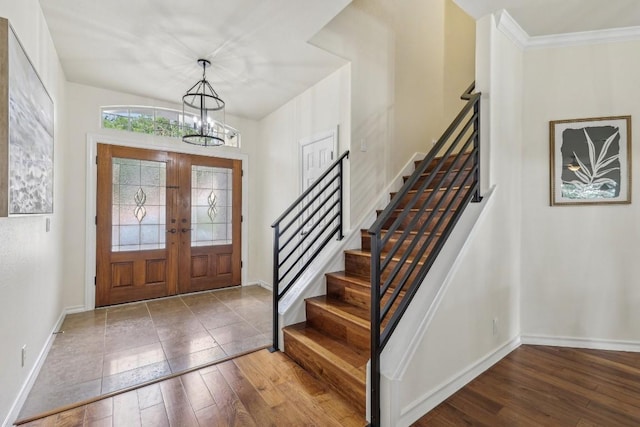14277 Fm 2769, Leander, TX 78641 - foyer entrance featuring a chandelier, stairway, hardwood / wood-style flooring, and french doors