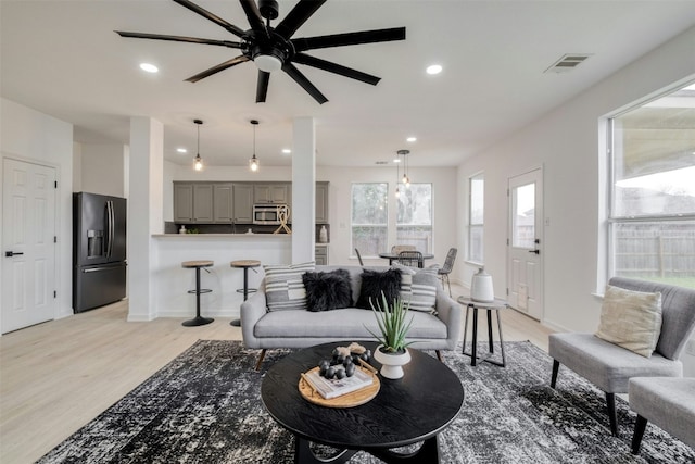 13701 Glen Mark Dr, Manor, TX 78653 - living room with light wood-style flooring, a ceiling fan, and recessed lighting