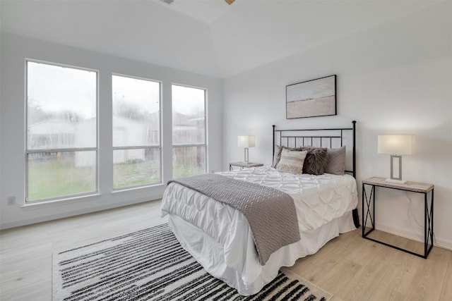13701 Glen Mark Dr, Manor, TX 78653 - bedroom with light wood-style floors and lofted ceiling