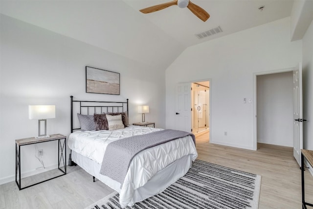 13701 Glen Mark Dr, Manor, TX 78653 - bedroom with light wood finished floors, vaulted ceiling, connected bathroom, and ceiling fan