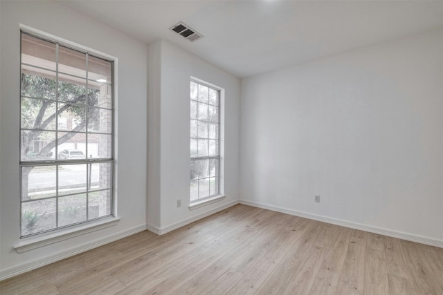 13701 Glen Mark Dr, Manor, TX 78653 - empty room featuring light wood-type flooring and plenty of natural light