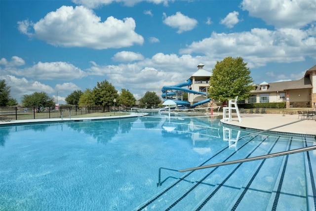 13701 Glen Mark Dr, Manor, TX 78653 - community pool featuring a water slide and a patio area