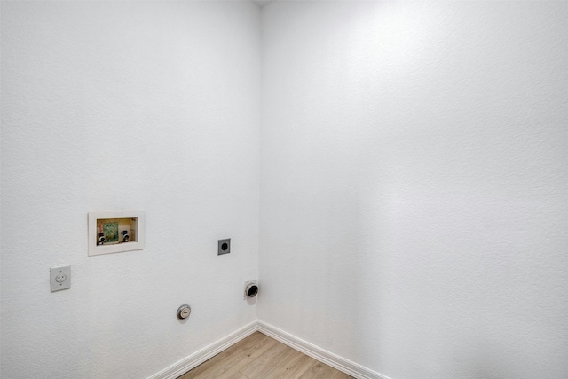 13701 Glen Mark Dr, Manor, TX 78653 - washroom with electric dryer hookup, washer hookup, light wood-type flooring, and gas dryer hookup