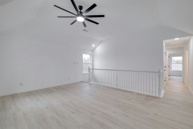 13701 Glen Mark Dr, Manor, TX 78653 - spare room featuring attic access, vaulted ceiling, healthy amount of natural light, light wood finished floors, and a ceiling fan