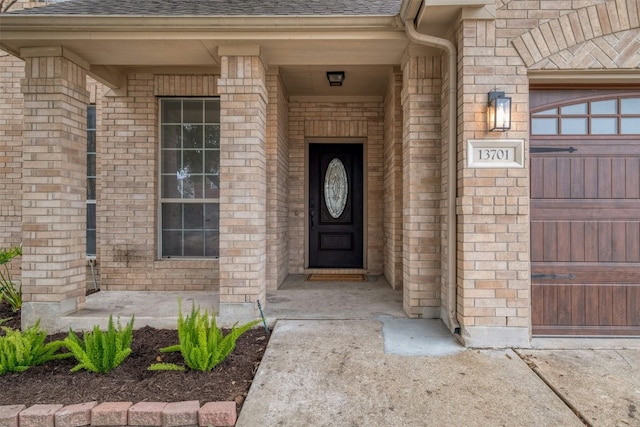 13701 Glen Mark Dr, Manor, TX 78653 - doorway to property featuring a shingled roof and brick siding