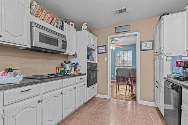 kitchen featuring light tile patterned floors, stainless steel appliances, white cabinets, and ceiling fan