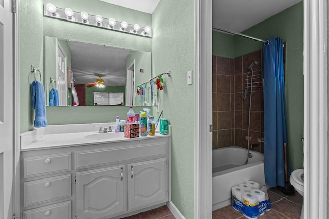 full bathroom with vanity, tile patterned floors, toilet, and shower / bath combo with shower curtain