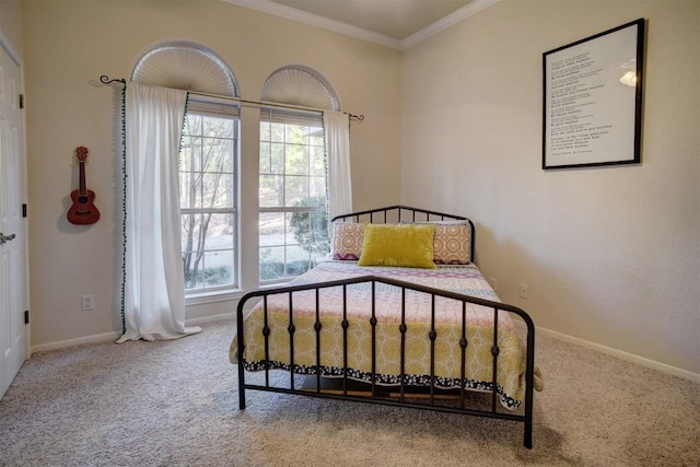 carpeted bedroom featuring crown molding