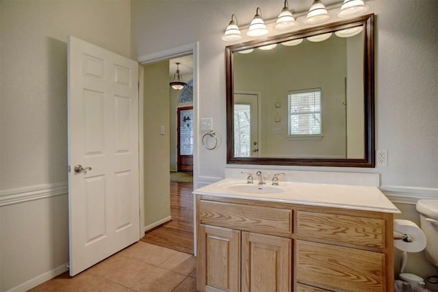 bathroom with vanity, tile patterned floors, and toilet