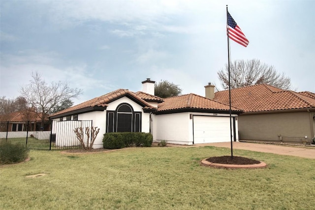 mediterranean / spanish home with a front yard and a garage