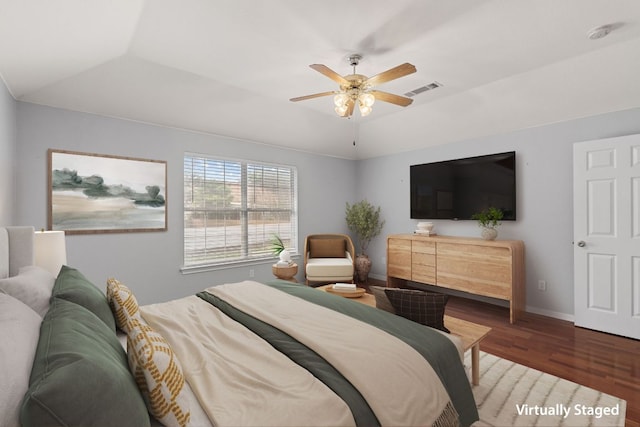 30388 Ledgemont Ln, Georgetown, TX 78628 - bedroom with ceiling fan, visible vents, baseboards, vaulted ceiling, and wood finished floors