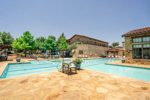 view of swimming pool featuring a patio