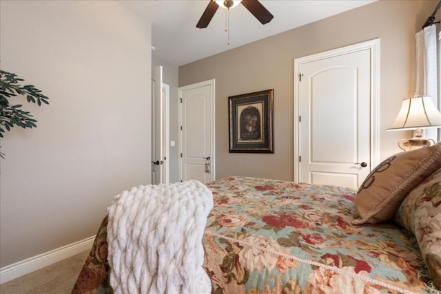 bedroom featuring ceiling fan and carpet