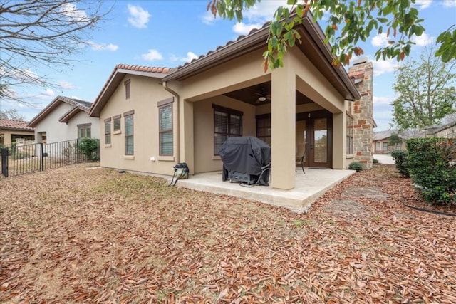 back of house with a patio and ceiling fan