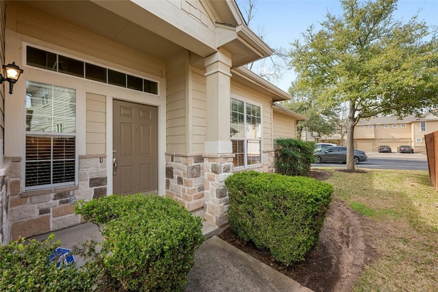 view of exterior entry with stone siding