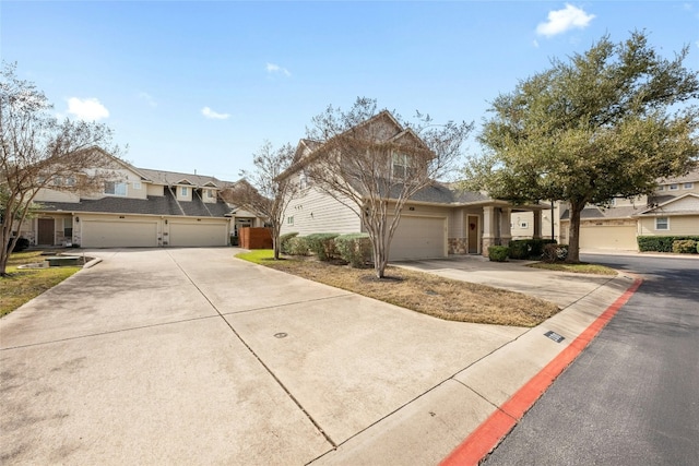 traditional home featuring concrete driveway