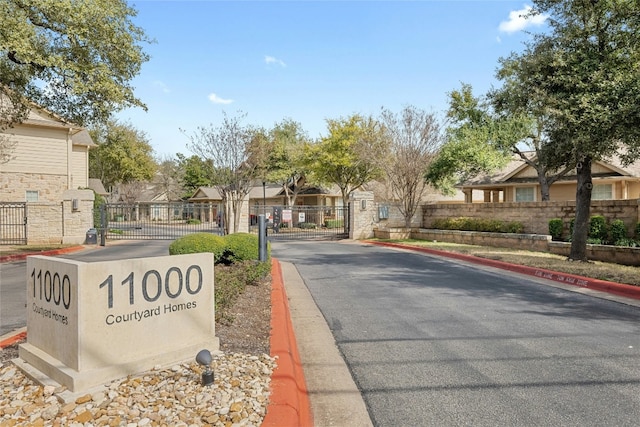 11000 Anderson Mill Rd Unit 100, Austin, TX 78750 - community sign with a gate and a residential view