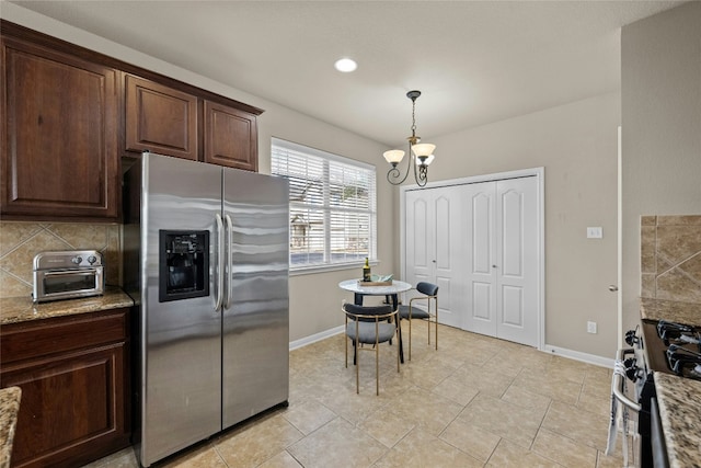 11000 Anderson Mill Rd Unit 100, Austin, TX 78750 - kitchen with stainless steel appliances, baseboards, a chandelier, backsplash, and recessed lighting