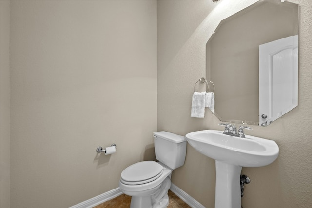 11000 Anderson Mill Rd Unit 100, Austin, TX 78750 - half bath with toilet, baseboards, and tile patterned floors