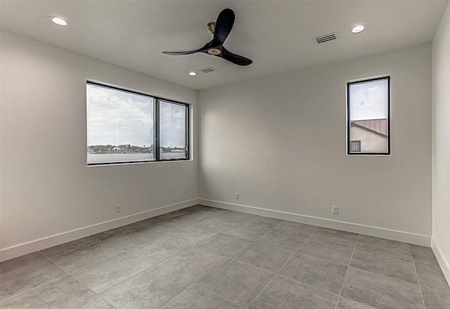 1012 Impala Dr, Granite Shoals, TX 78654 - empty room with a ceiling fan, visible vents, and a healthy amount of sunlight