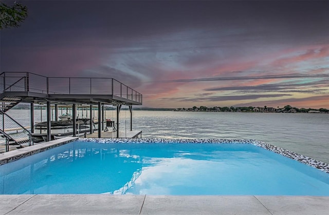 1012 Impala Dr, Granite Shoals, TX 78654 - view of swimming pool with a water view, boat lift, and a dock