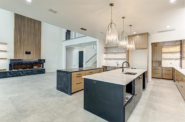 1012 Impala Dr, Granite Shoals, TX 78654 - kitchen with open shelves, visible vents, a large island, and a sink