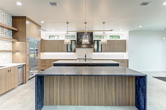 1012 Impala Dr, Granite Shoals, TX 78654 - kitchen featuring open shelves, appliances with stainless steel finishes, an island with sink, and visible vents