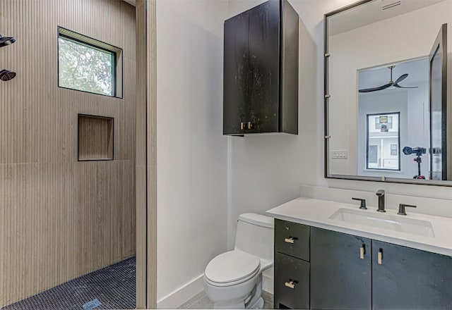 1012 Impala Dr, Granite Shoals, TX 78654 - full bath featuring walk in shower, tile patterned flooring, vanity, toilet, and baseboards