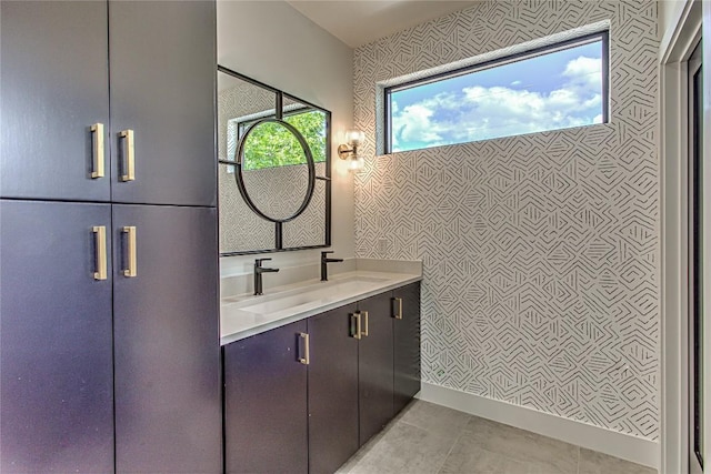 1012 Impala Dr, Granite Shoals, TX 78654 - bathroom with vanity, wallpapered walls, and tile patterned flooring