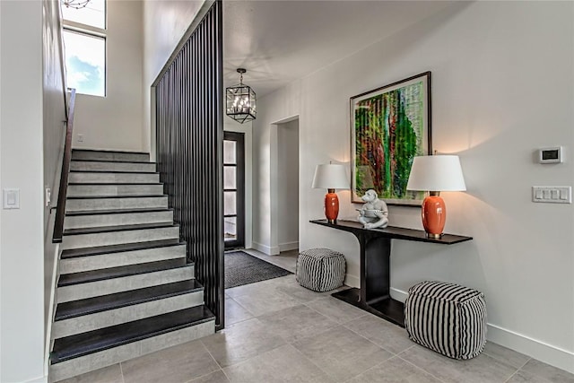 1012 Impala Dr, Granite Shoals, TX 78654 - stairway with a chandelier and baseboards