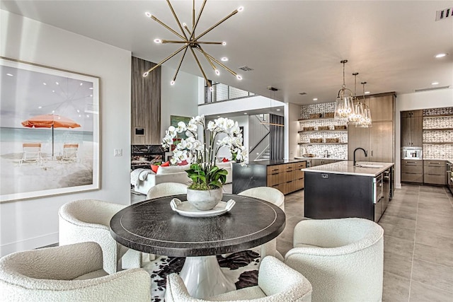 1012 Impala Dr, Granite Shoals, TX 78654 - dining room with a chandelier, stairway, recessed lighting, and light tile patterned floors