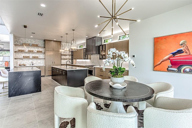 1012 Impala Dr, Granite Shoals, TX 78654 - dining space with a chandelier, healthy amount of natural light, light tile patterned floors, and recessed lighting