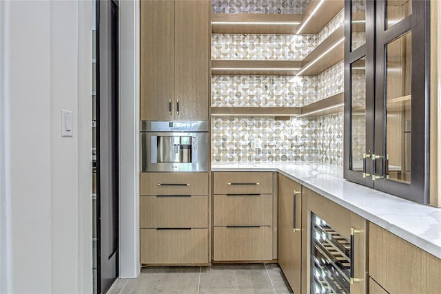 1012 Impala Dr, Granite Shoals, TX 78654 - bar featuring beverage cooler, backsplash, oven, and light tile patterned flooring