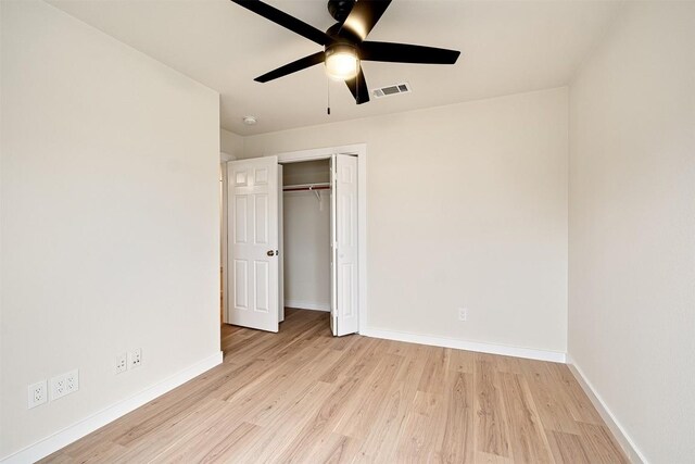 1302 Olympus Dr, Austin, TX 78733 - unfurnished bedroom with light wood-style floors, baseboards, a closet, and ceiling fan