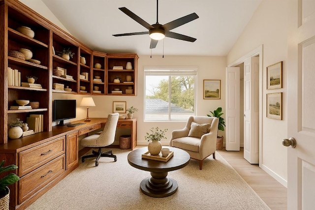 1302 Olympus Dr, Austin, TX 78733 - home office featuring built in study area, lofted ceiling, a ceiling fan, light wood-style floors, and baseboards