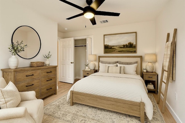 1302 Olympus Dr, Austin, TX 78733 - bedroom with baseboards, light wood-style flooring, a closet, and ceiling fan
