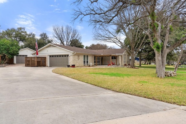 ranch-style house with a garage and a front yard