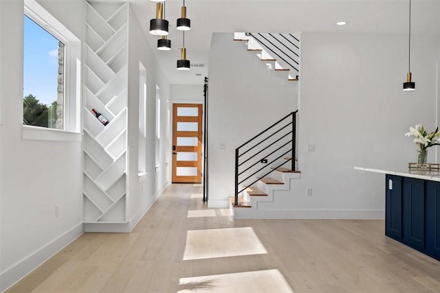 501 E Burton St, Manor, TX 78653 - entryway featuring stairway and light wood-style flooring