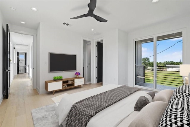 bedroom featuring access to exterior, light hardwood / wood-style flooring, and ceiling fan