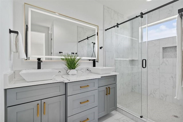 501 E Burton St, Manor, TX 78653 - full bathroom with marble finish flooring, a stall shower, and double vanity