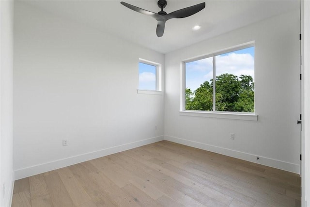 501 E Burton St, Manor, TX 78653 - spare room with light wood-style floors, ceiling fan, and recessed lighting