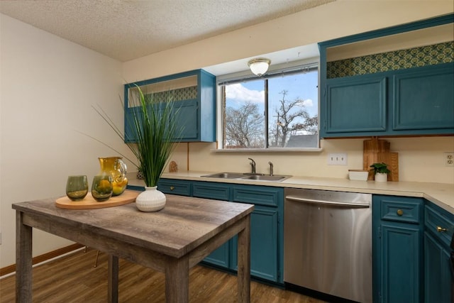 kitchen featuring blue cabinets, sink, a textured ceiling, stainless steel dishwasher, and dark hardwood / wood-style floors