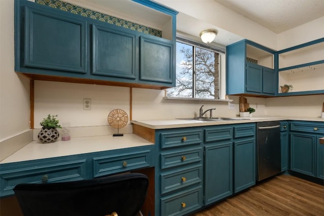 kitchen featuring dishwasher, blue cabinetry, sink, and dark hardwood / wood-style floors