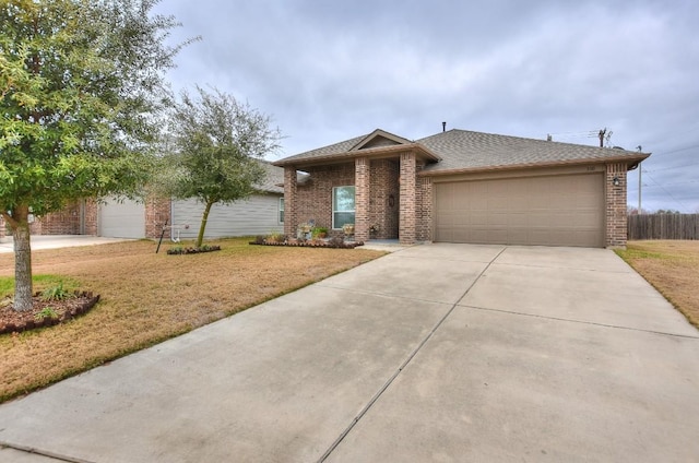 view of front of home with a garage and a front yard