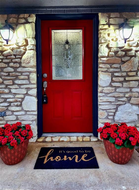 2000 Donna Dr, Taylor, TX 76574 - doorway to property with stone siding