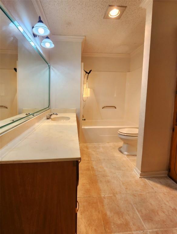 full bathroom with toilet, tub / shower combination, a textured ceiling, ornamental molding, and vanity