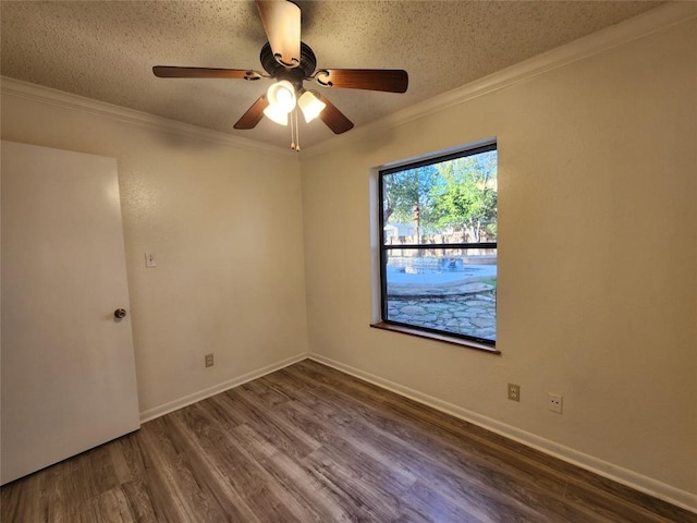 unfurnished room with ceiling fan, crown molding, dark hardwood / wood-style floors, and a textured ceiling