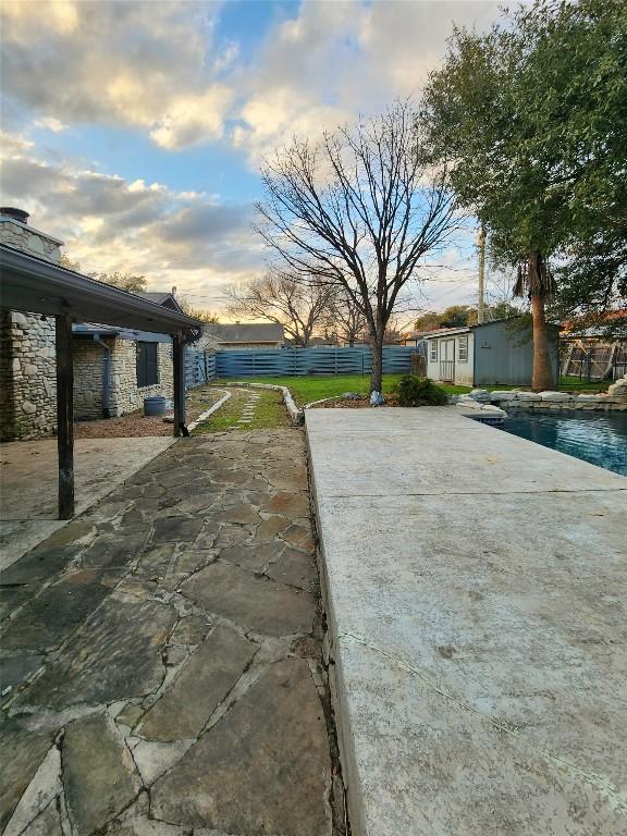 2000 Donna Dr, Taylor, TX 76574 - view of patio with a storage unit