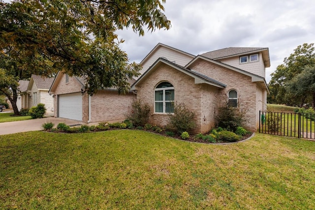 view of front of home with a garage and a front yard