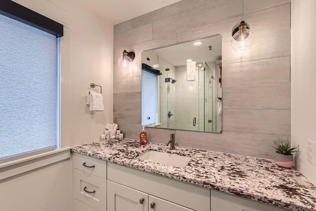 19217 Lost Tree Cv, Spicewood, TX 78669 - bathroom with vanity and a shower stall